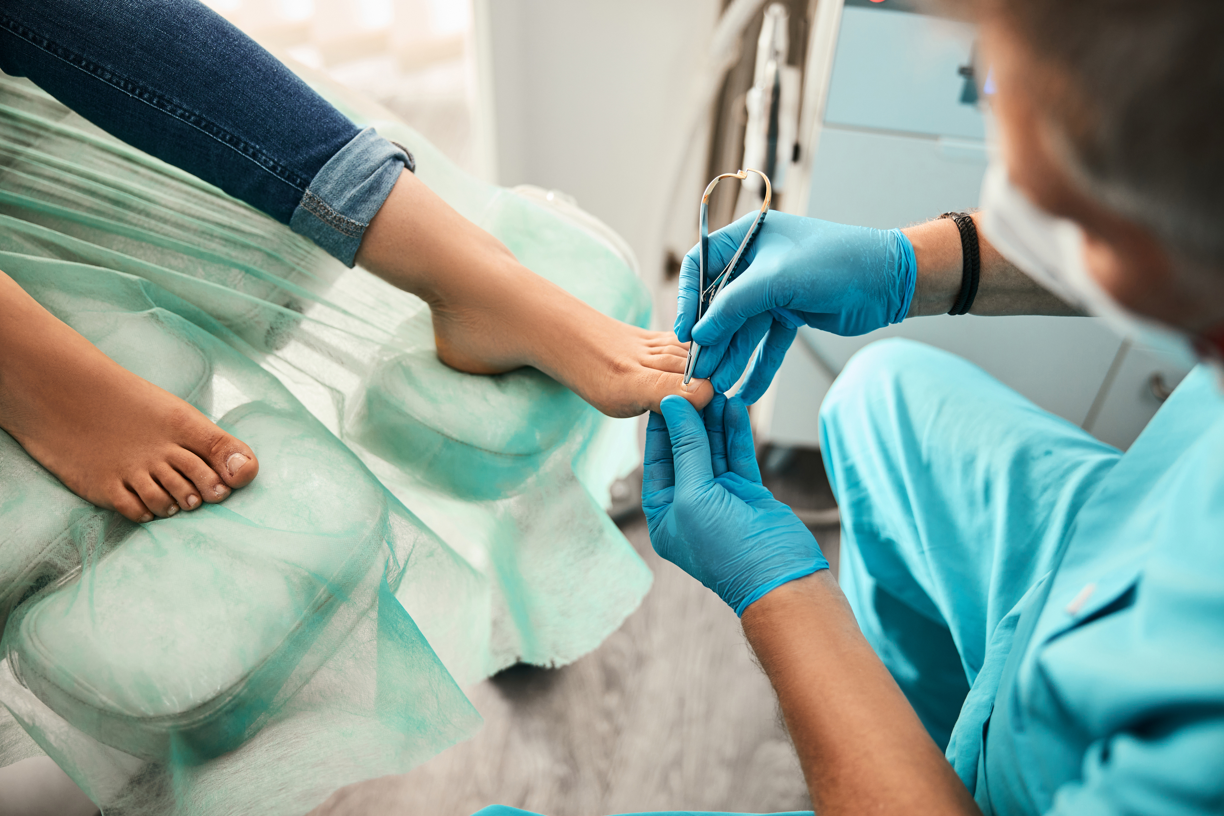 Female patient visiting podiatrist with pain on feet and toes